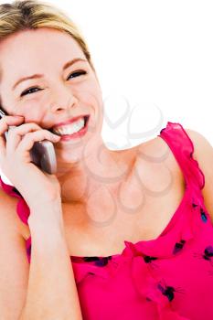 Caucasian woman talking on a mobile phone isolated over white