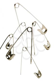Safety pins isolated over white
