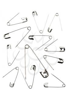 Sharp safety pins isolated over white