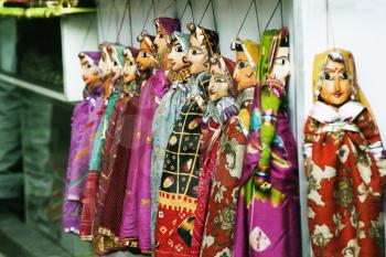 Wooden puppets hanging at a market stall, Delhi, India