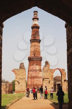 Tourists at a monument, Qutub Minar, New Delhi, India
