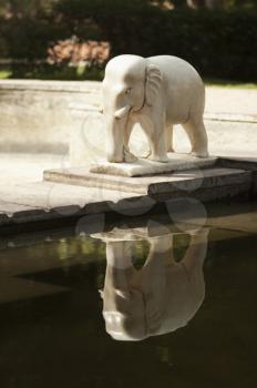 Reflection of an elephant statue on water, Lakshmi Narayan Temple, New Delhi, India