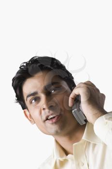 Close-up of a man talking on a mobile phone