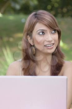 Close-up of a woman with a laptop