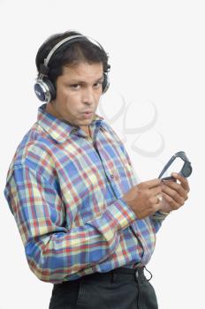 Man listening to music and whistling