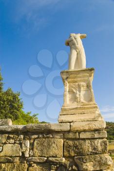 Low angle view of a headless statue, Odeon of Agrippa, The Ancient Agora, Athens, Greece