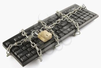 Computer keyboard locked with chain and padlock