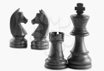 Chess pieces against a white background
