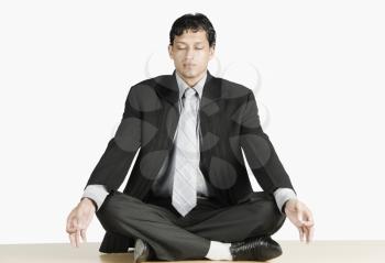 Businessman practicing yoga