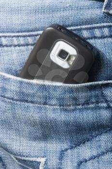 Mobile phone in a jeans pocket