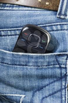 Mobile phone in a jeans pocket