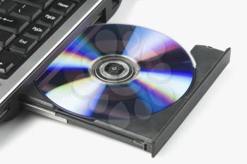 Close-up of a laptop ejecting a DVD