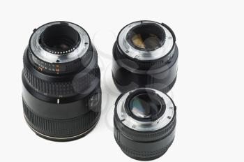 Close-up of three photographic lenses