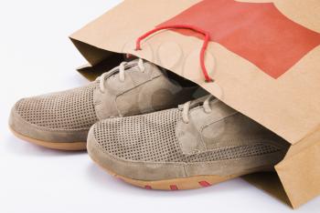 Close-up of a pair of shoes in a shopping bag