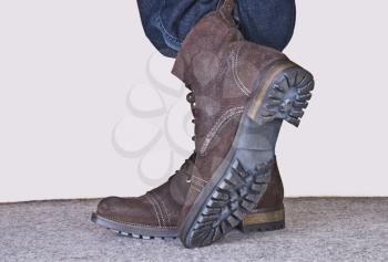 Low section view of a person wearing hiking boots