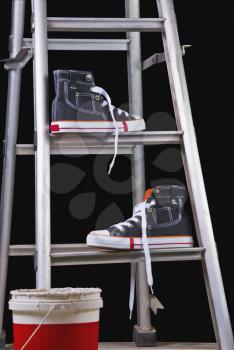 Shoes on a step ladder