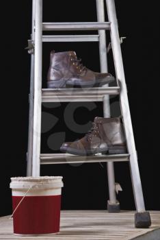 Leather boots on a step ladder