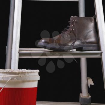 Leather boot on a step ladder