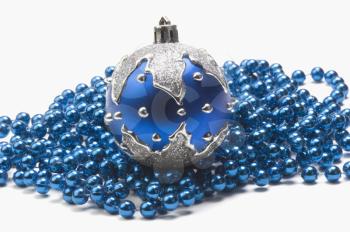 Blue bauble on string of blue beads