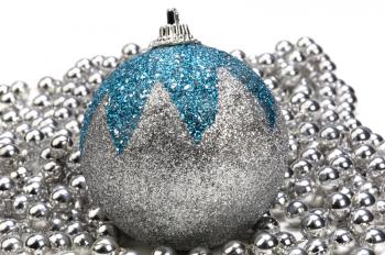 Close-up of a silver and blue bauble on string of silver beads