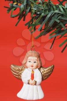 Christmas angel figurine hanging on a Christmas tree
