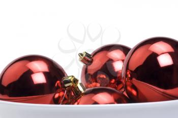 Close-up of red baubles in a bowl