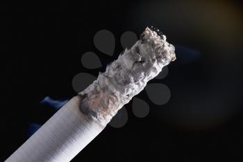 Close-up of a cigarette with ash
