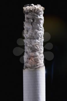 Close-up of a cigarette with ash