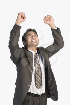 Businessman clenching fists in excitement