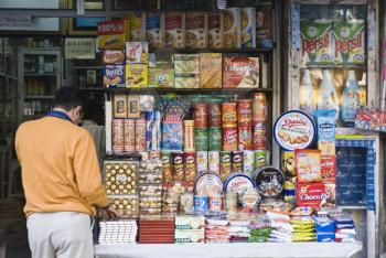 Man shopping in a street market, New Delhi, India