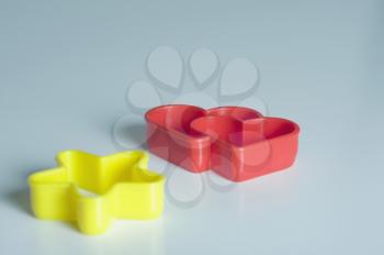 Close-up of a star and a heart shaped cookie cutters