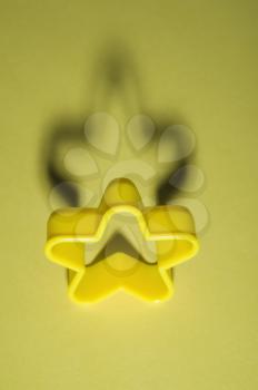 Star shaped cookie cutter of yellow color