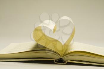 Pages of a book making a heart shape