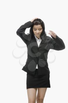 Businesswoman with her hand in hair