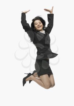 Portrait of a businesswoman jumping with joy