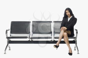 Businesswoman sitting on an armchair