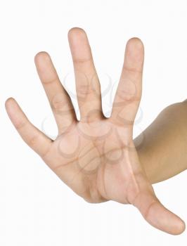 Close-up of a person's hand making a stop gesture