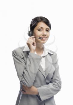 Female customer care executive wearing a headset against a white background