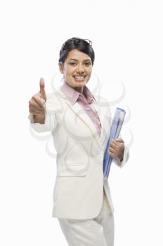 Portrait of a businesswoman showing thumbs up