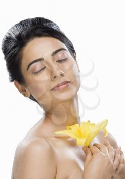 Woman smelling a flower