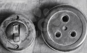 Close-up of an old lightswitch and a socket