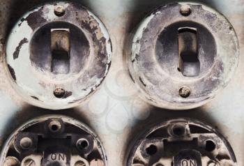 Close-up of old lightswitches