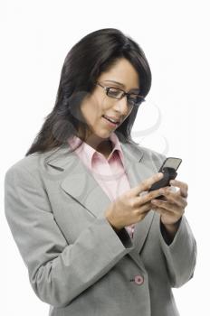 Businesswoman text messaging
