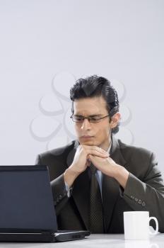 Businessman looking at a laptop