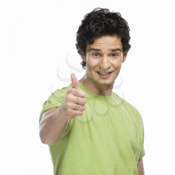Portrait of a man showing thumbs up sign