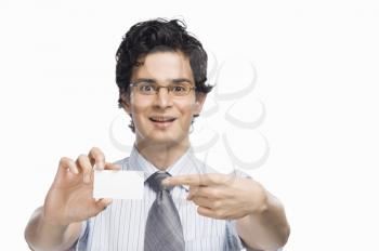 Portrait of a businessman showing a blank business card