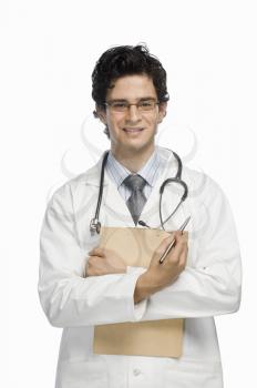 Portrait of a male doctor holding a clipboard