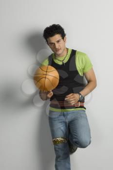 Portrait of a man holding a basketball