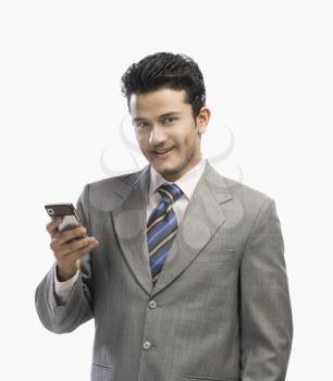 Portrait of a businessman using a mobile phone