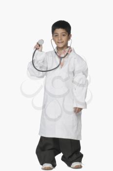 Portrait of a boy holding a stethoscope